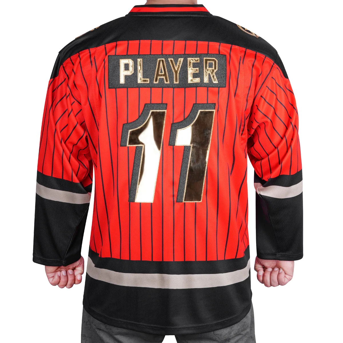 Back of red pinstripe hockey jersey showing PLAYER nameplate and gold number 11